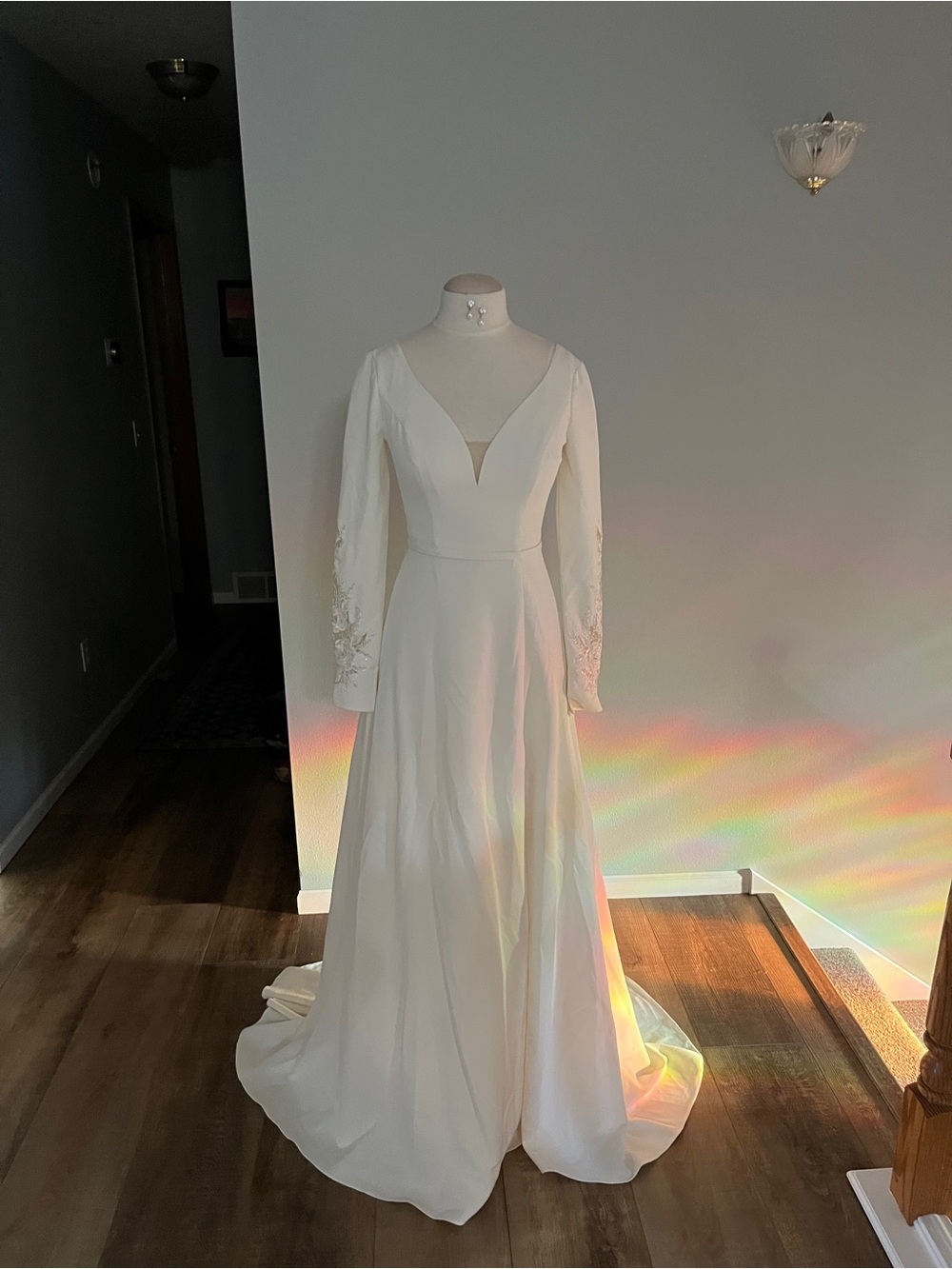 Elegant Long-Sleeve White Bridal Gown with Deep V Neck
